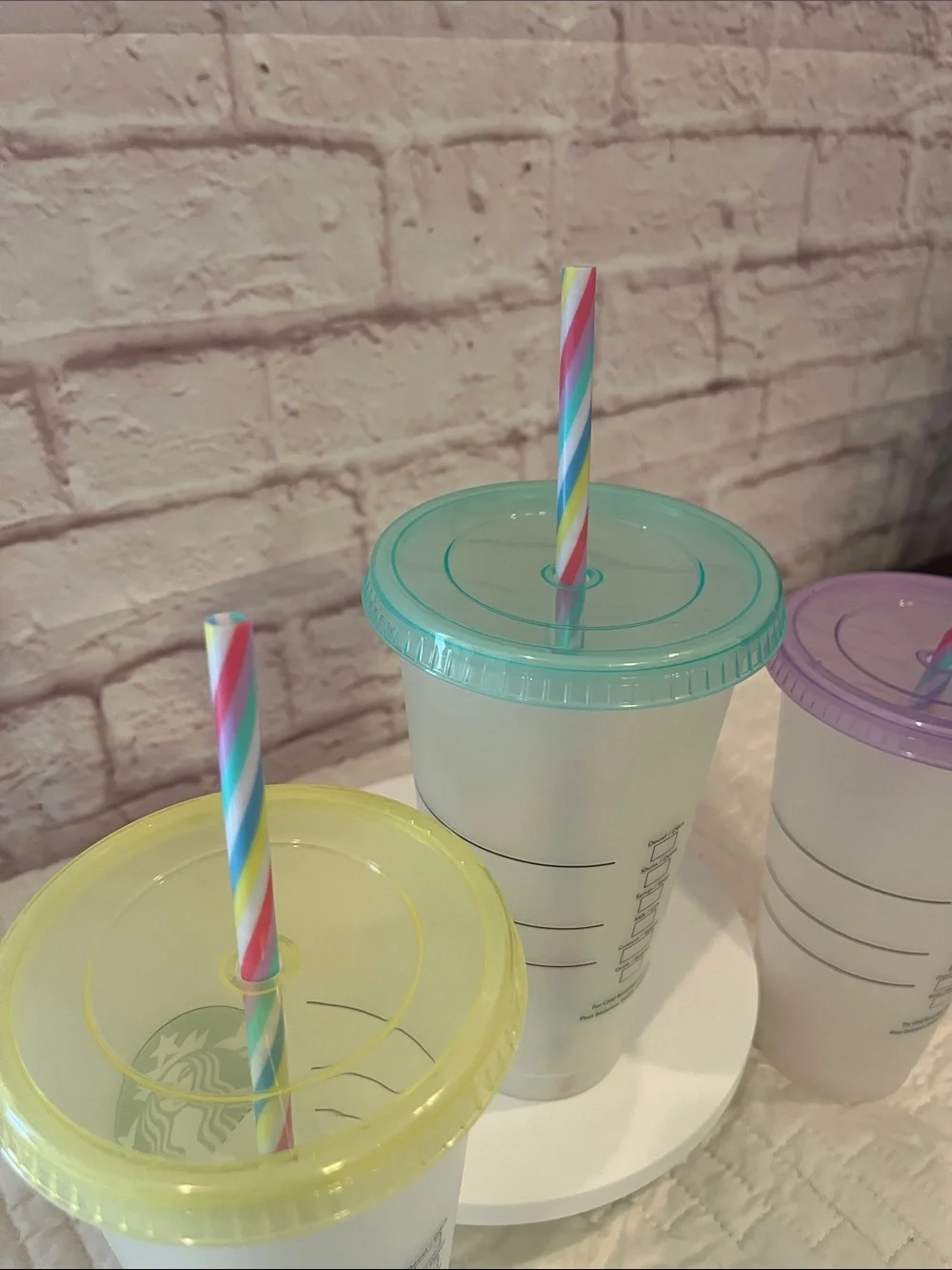 Starbucks Reusable Cups with Yellow, Teal, and Purple Lids